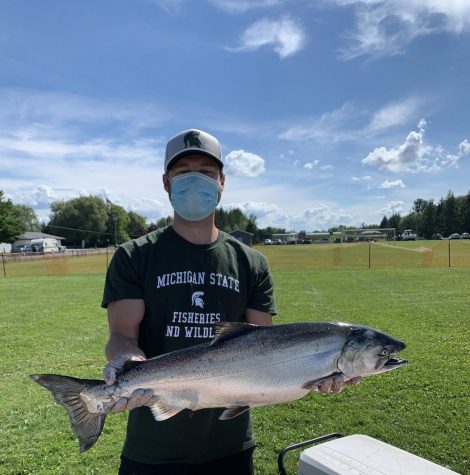 Jake Sawecki holding a salmon