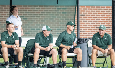 MSU head coach Damon Rensing (far right) sits next to his coaching staff/ Photo Credit: MSU Athletic Communications


