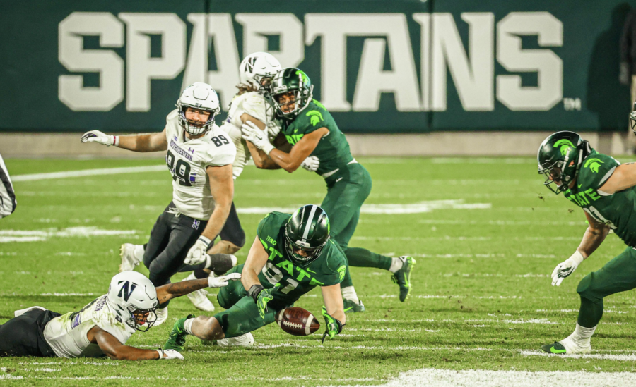 MSU defensive end Jack Camper recovers a fumble in the Spartans' 29-20 win over No. 8 Northwestern on Nov. 28, 2020/ Photo Credit: MSU Athletic Communications

