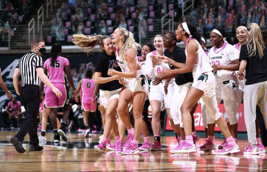 Tory Ozment gets mobbed after draining a 3-pointer at the buzzer to give the Spartans a 76-73 home win over Purdue/Photo Credit: MSU Athletic Communications

