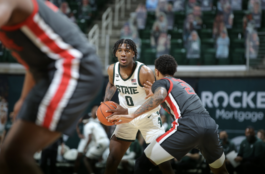 MSU forward Aaron Henry looks for an open teammate against No. 5 Ohio State/ Photo Credit: MSU Athletic Communications



