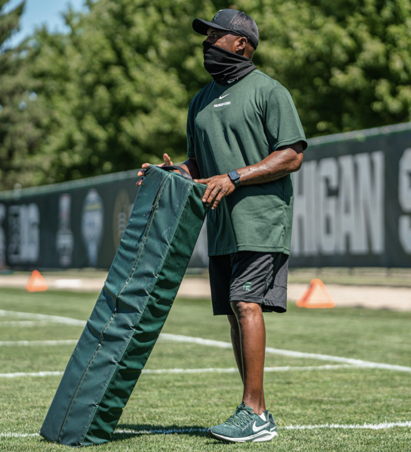 MSU wide receiver Courtney Hawkins holds a bag during football practice/ Photo Credit: MSU Athletic Communications 


