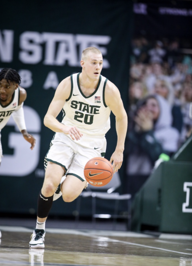 MSU forward Joey Hauser brings the ball up the court during a game in 2020/ Photo Credit: MSU Athletic Communications 


