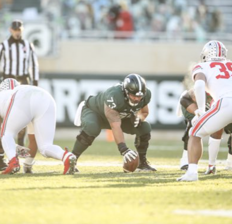 MSU+offensive+lineman+Jacob+Isaia+%2873%29+lines+up+at+center+in+the+Spartans+52-10+loss+to+No.+3+Ohio+State%2F+Photo+Credit%3A+MSU+Athletic+Communications+