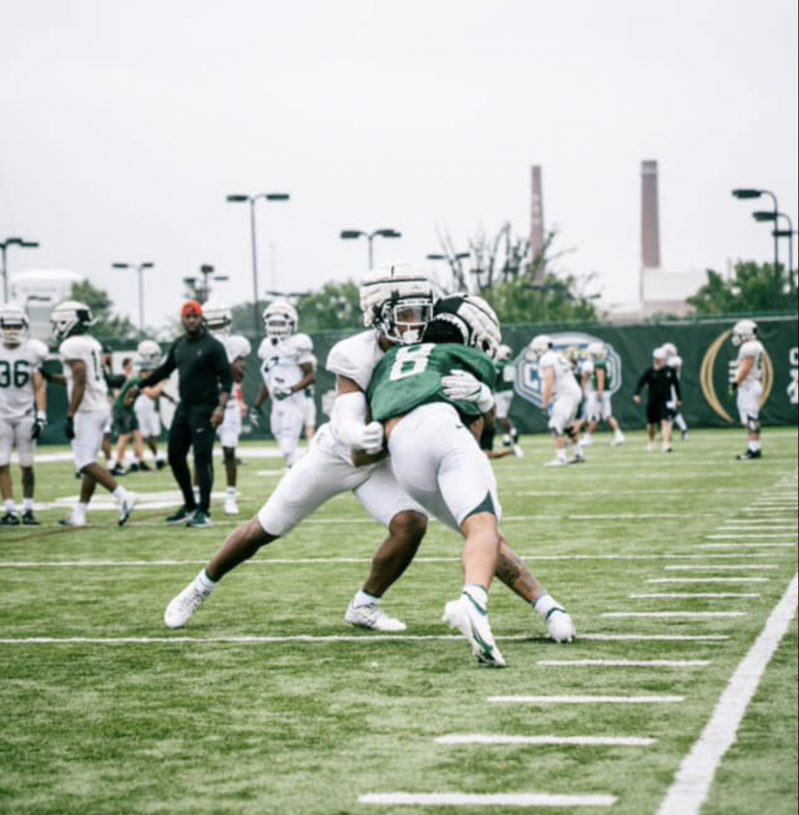 MSU wide receiver Jalen Nailor runs over a defender during fall practice/ Photo Credit: MSU Athletic Communications 