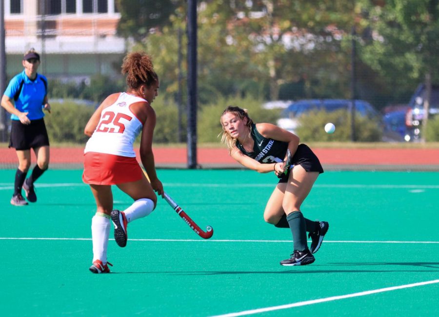 Midfielder Maddie McDonough takes a shot as an Ohio State defender closes in. Photo: Sarah Smith/WDBM