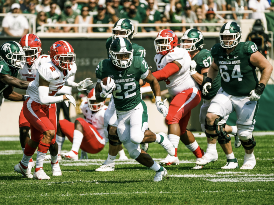 MSU+running+back+Jordon+Simmons+hits+the+hole+and+runs+for+a+big+gain+in+the+Spartans+42-14+home+win+over+Youngstown+State+on+Sept.+11%2C+2021%2F+Photo+Credit%3A+MSU+Athletic+Communications+