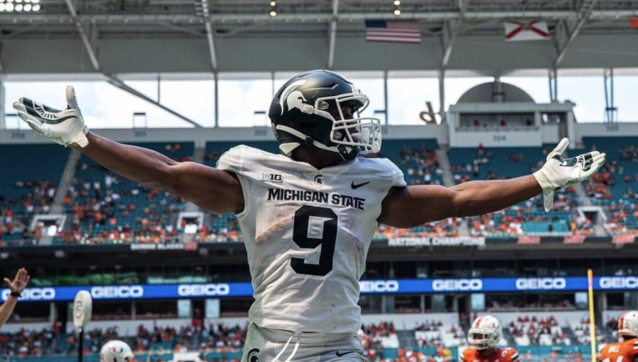 MSU+running+back+Kenneth+Walker+celebrates+after+scoring+a+touchdown+in+the+Spartans+38-17+win+over+No.+24+Miami+on+Sept.+18%2C+2021%2F+Photo+Credit%3A+MSU+Athletic+Communications+