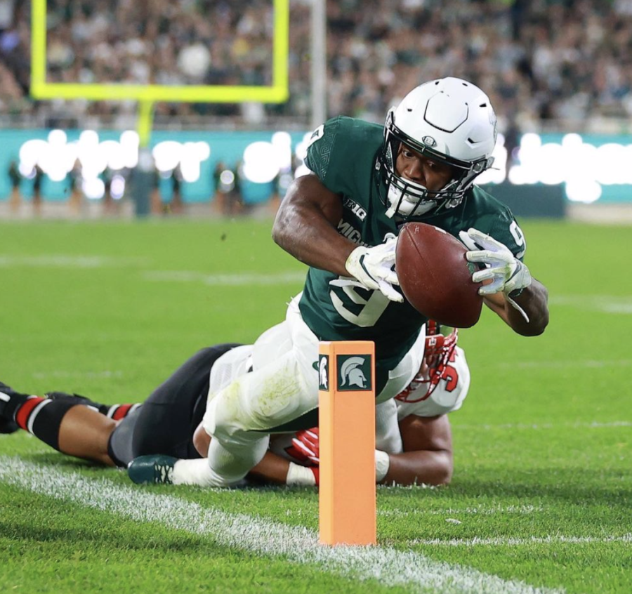 MSU+running+back+Kenneth+Walker+dives+for+the+pylon+in+the+Spartans+48-31+win+over+Western+Kentucky+on+Oct.+2%2C+2021%2F+Photo+Credit%3A+MSU+Athletic+Communications+