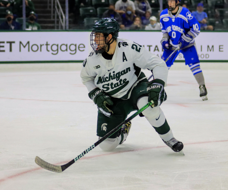 MSU forward Josh Nodler  falls to the ice in the Spartans' 5-1 win over Air Force on Oct. 9, 2021/ Photo Credit: Sarah Smith/WDBM
