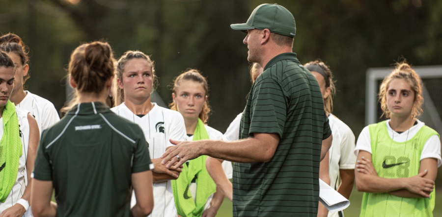 MSU head coach Jeff Hosler talks with his team during a fall 2021 practice/ Photo Credit: MSU Athletic Communications 