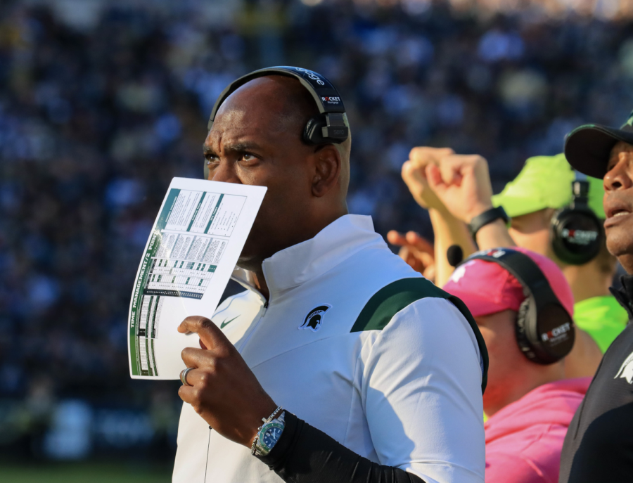 MSU head coach Mel Tucker reads from a play sheet during the Spartans matchup with Purdue on Nov. 6, 2021/ Photo Credit: Sarah Smith/WDBM