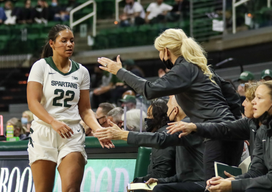 MSU+forward+Moira+Joiner+high-fives+head+coach+Suzy+Merchant+during+the+Spartans+93-31+win+over+Morehead+State+on+Nov.++9%2C+2021%2F+Photo+Credit%3A+Sarah+Smith%2FWDBM