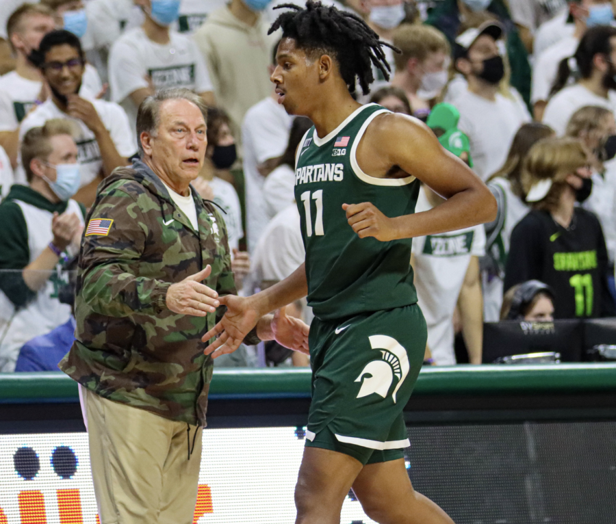 MSU point guard A.J. Hoggard gets high-fived by head coach Tom Izzo in the Spartans 90-46 win over Western Michigan on Nov. 12,  2021/ Photo Credit: Sarah Smith/WDBM
