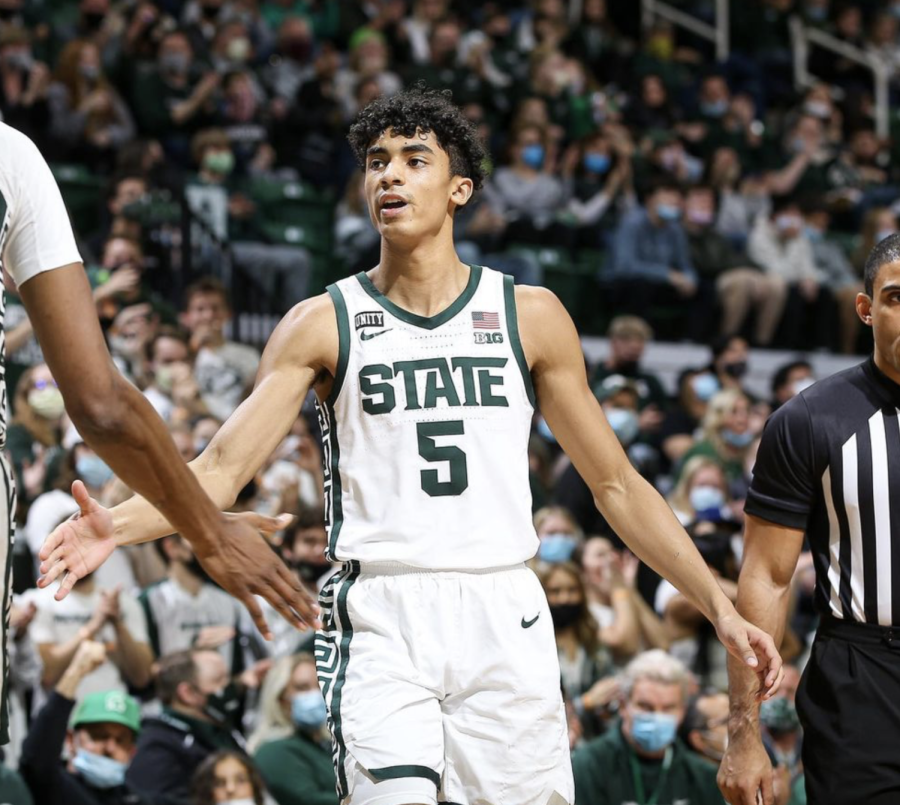 MSU forward Max Christie high-fives center Marcus Bingham during the Spartans 73-64 win over Louisville on Dec. 1, 2021/ Photo Credit: MSU Athletic Communications 
