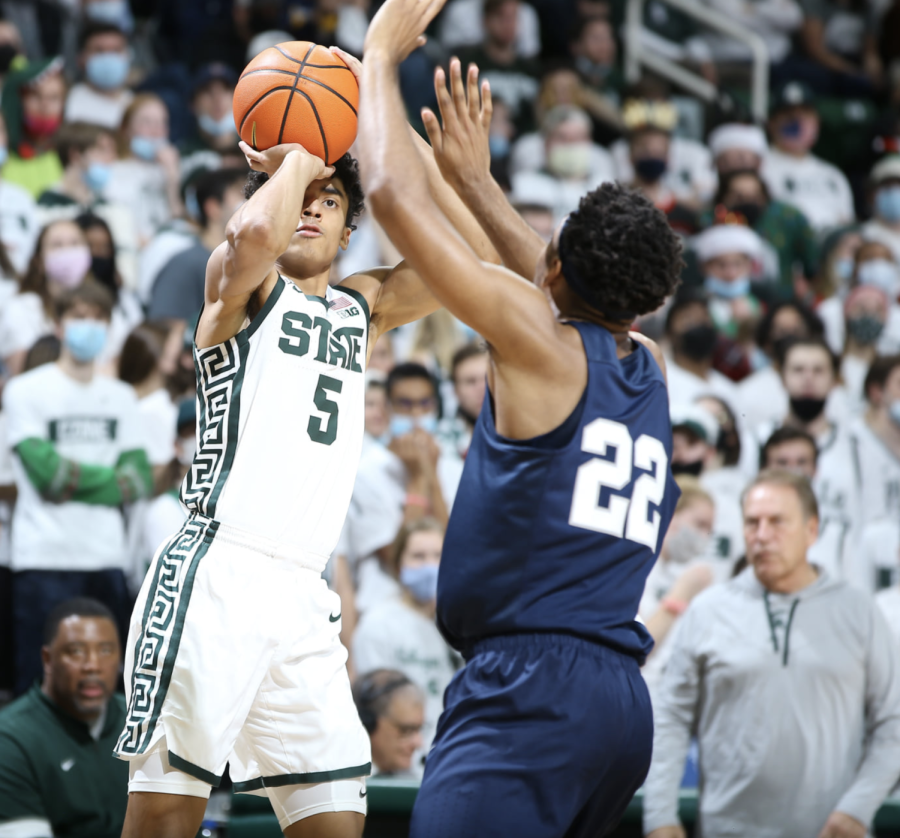 MSU+guard+Max+Christie++takes+a+contested+shot+over+Penn+State+guard+Jalen+Pickett+during+the+Spartans+80-64+home+win+over+Penn+State+on+Dec.+11%2C+2021%2F+Photo+Credit%3A+MSU+Athletic+Communications