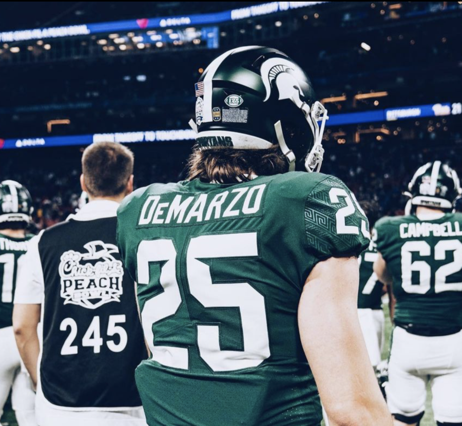 MSU linebacker Cole DeMarzo stands on the sideline during the 2021 Peach Bowl/ Photo Credit: MSU Athletic Communications 
