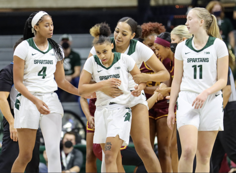 MSU guard Deedee Hagemann, alongside forwards Alisa Smith (4), Matilda Ekh (11) and Taiyier Parks gather together during the Spartans 74-71 home win over Minnesota on Jan. 23, 2022/ Photo Credit: Sarah Smith/WDBM