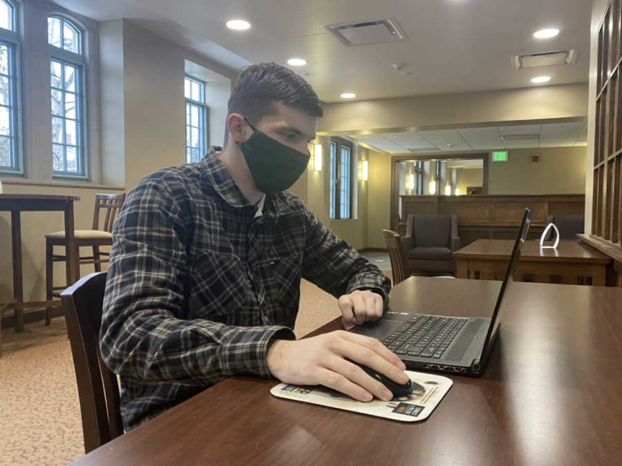 Michigan State student Eric Shepard prepares for his online class/ Photo credit: Taylor Truszkowski