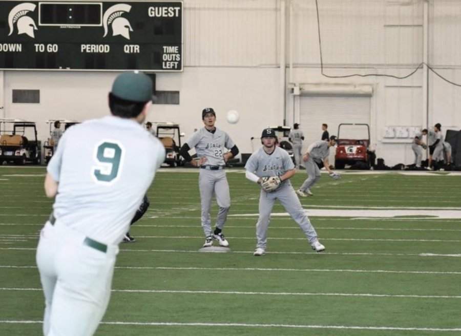 MSU infielder Jacob Anderson (9) throws the ball to Trent Farquhar on Feb. 2, 2022/ Photo Credit: MSU Athletic Communications 
