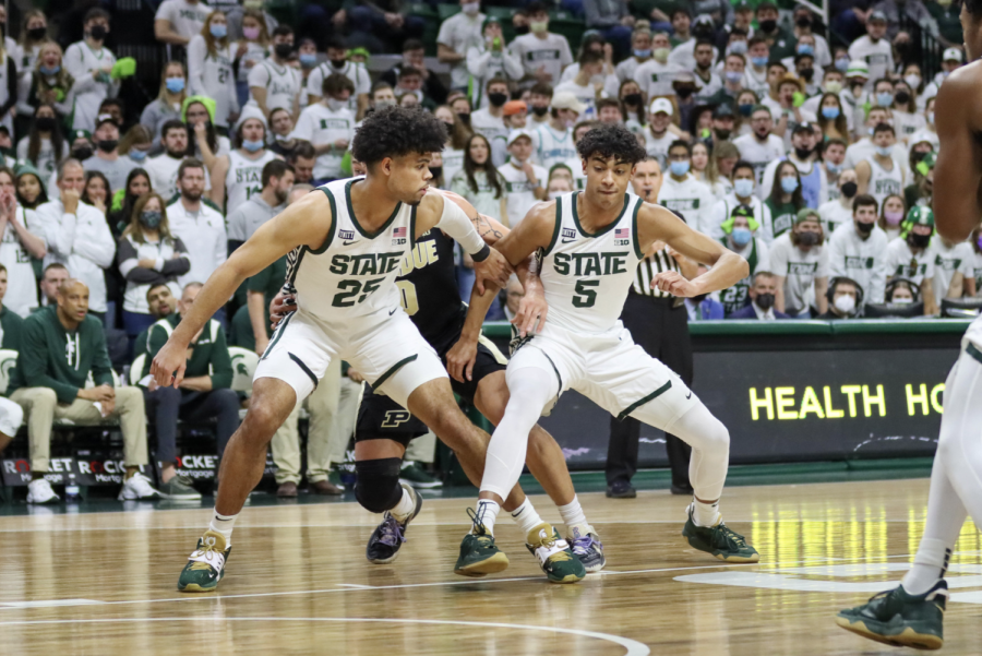 Michigan State mens basketballs Malik Hall and Max Christie box out an opponent in the Spartans win over Purdue at the Breslin Center on Feb. 26, 2022/Photo Credit: Sarah Smith/WDBM