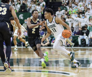 MSU point guard A.J. Hoggard drives past Eric Hunter Jr. during the Spartans 68-65 win over No. 4 Purdue on Feb. 26, 2022/ Photo Credit: Sarah Smith/WDBM
