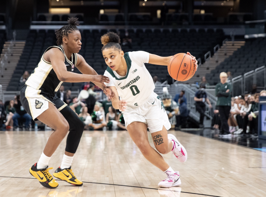 MSU guard Deedee Hagemann drives past a Purdue player during the Spartans 73-69 Big Ten Tournament win March 3, 2022/ Photo Credit: MSU Athletic Communications