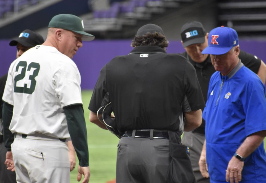 MSU manager Jake Boss exchanges a lineup card with an umpire before the Spartans take on Kansas on March 4, 2022/ Photo Credit: MSU Athletic Communications 