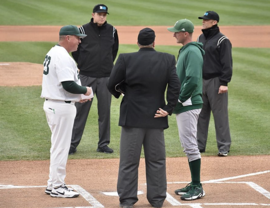 MSU manager Jake Boss hands his lineup card to the home plate umpire before the Spartans take on Eastern Michigan on April 20, 2022/ Photo Credit: MSU Athletic Communications