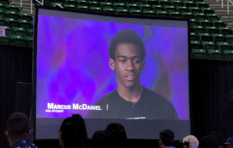 A screen shows Black Student Alliance President Marcus McDaniel as a part of a video made by MSU students.