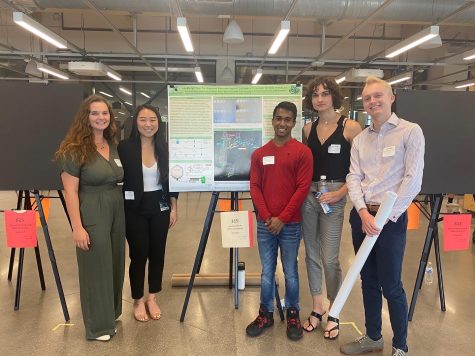 iGem team by their poster for MSU Mid-Sure
