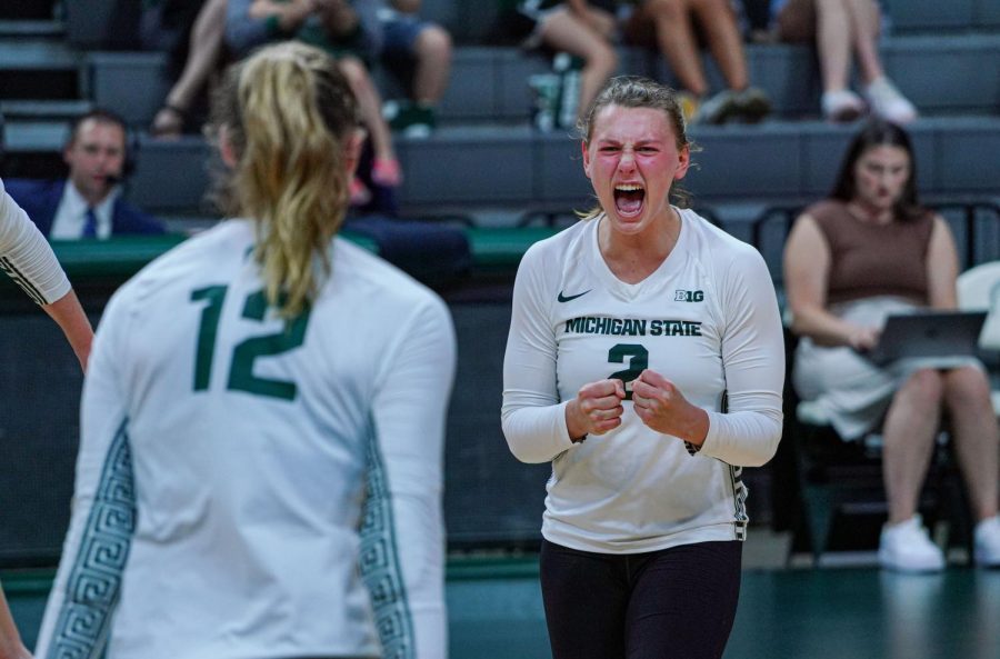 Zoe Nunez celebrates with teammates after a point in Michigan States win over Oakland on September 16, 2022. Photo Credit: Sarah Smith/WDBM