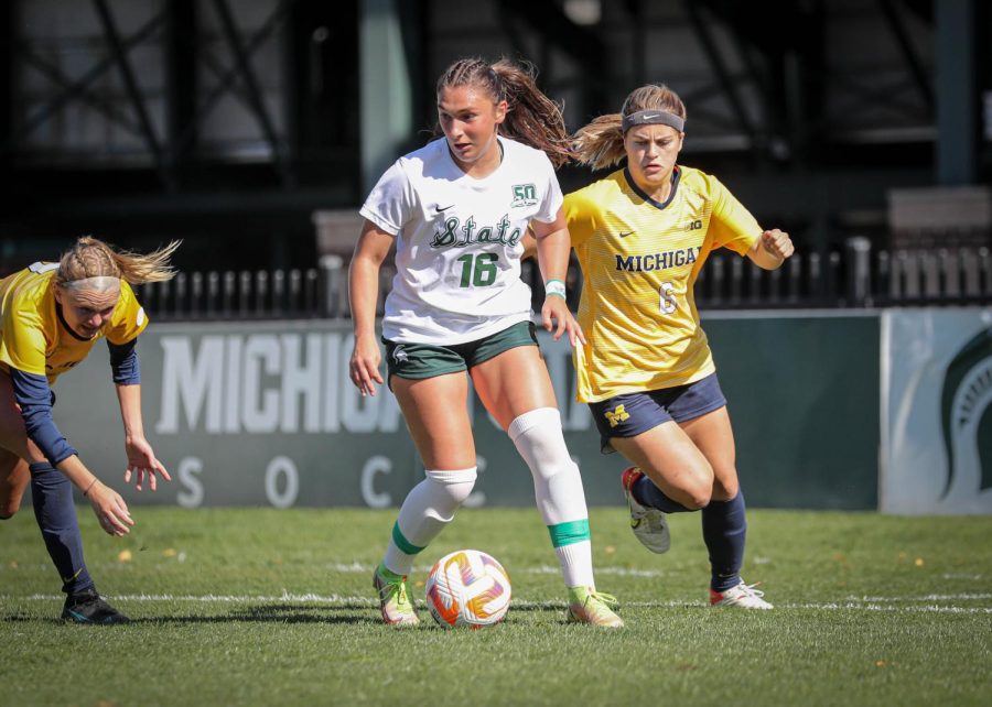 Ruby Diodati keeps the ball away from a Michigan defender during the Spartans 2-0 victory over the Wolverines on October 9, 2022. Photo Credit: Sarah Smith/WDBM