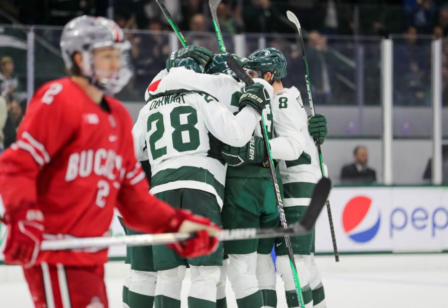 Michigan State teammates celebrate after a goal during their victory over Ohio State on November 10, 2022. Photo Credit: Sarah Smith/WDBM