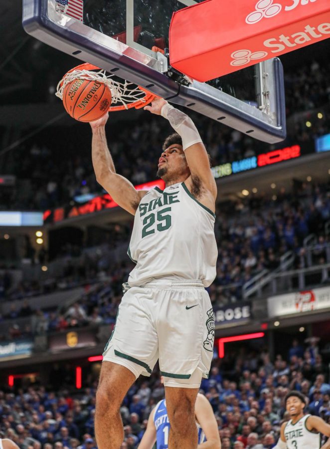 Malik+Hall+dunks+the+ball+to+tie+the+game+and+send+the+Spartans+to+a+second+overtime+during+Michigan+States++victory+over+4th+ranked+Kentucky+in+the+Champions+Classic+on+November+15%2C+2022.+Photo+Credit%3A+Sarah+Smith%2FWDBM