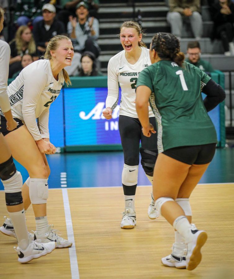 Rebecka Poljan and Zoe Nunez celebrate after a point during Michigan States match against Ohio State on November 5, 2022. Photo Credit: Sarah Smith/WDBM