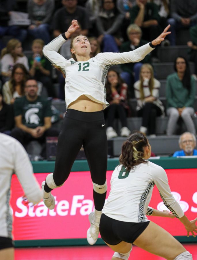 Evie Doezema jumps up to hit the ball during Michigan States loss to Ohio State on November 5, 2022. Photo Credit: Sarah Smith/WDBM