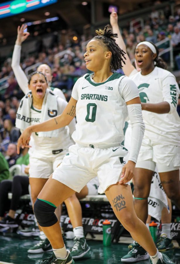 The+Michigan+State+bench+and+DeeDee+Hagemann+celebrates+after+a+Hagemann+three-pointer+during+the+Spartans+97-49+victory+over+Western+Michigan+on+November+13%2C+2022.+Photo+Credit%3A+Sarah+Smith%2FWDBM