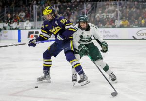 Daniel Russell goes for the puck during Michigan States 2-1 victory over Michigan on December 9, 2022. Photo Credit: Sarah Smith/WDBM