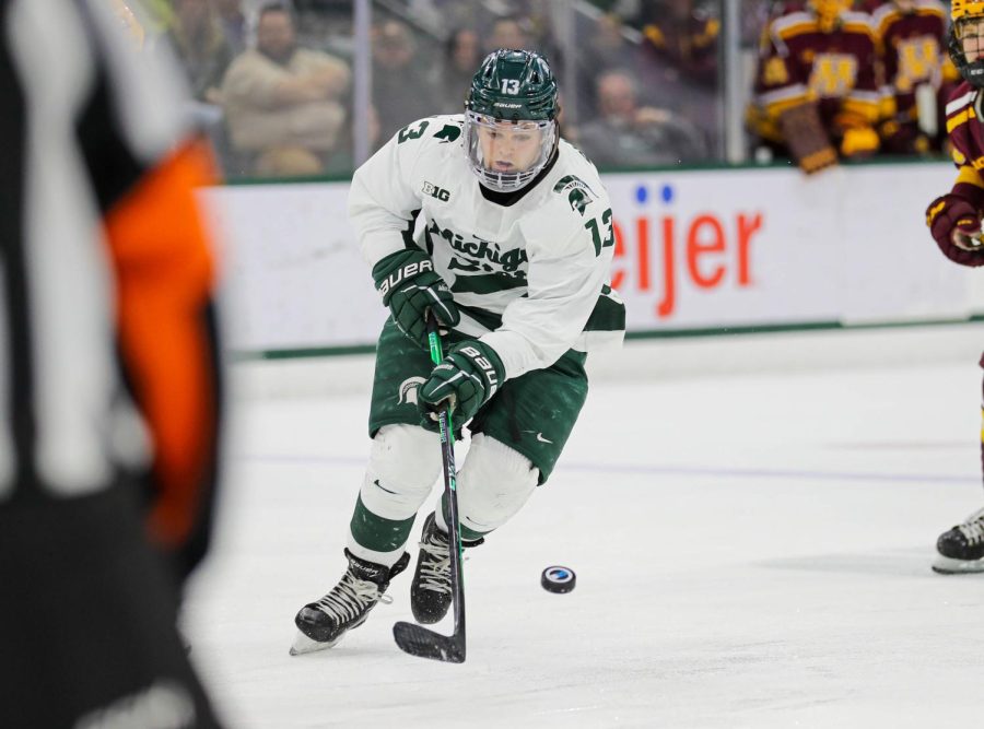 Tiernan Shoudy brings the puck up the ice during Michigan States loss to Minnesota on December 3, 2022. Photo Credit: Sarah Smith/WDBM