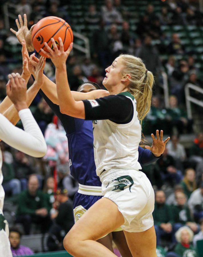 Tory Ozmet shoots the ball during Michigan States loss to Georgia Tech on December 1, 2022. Photo Credit: Sarah Smith/WDBM