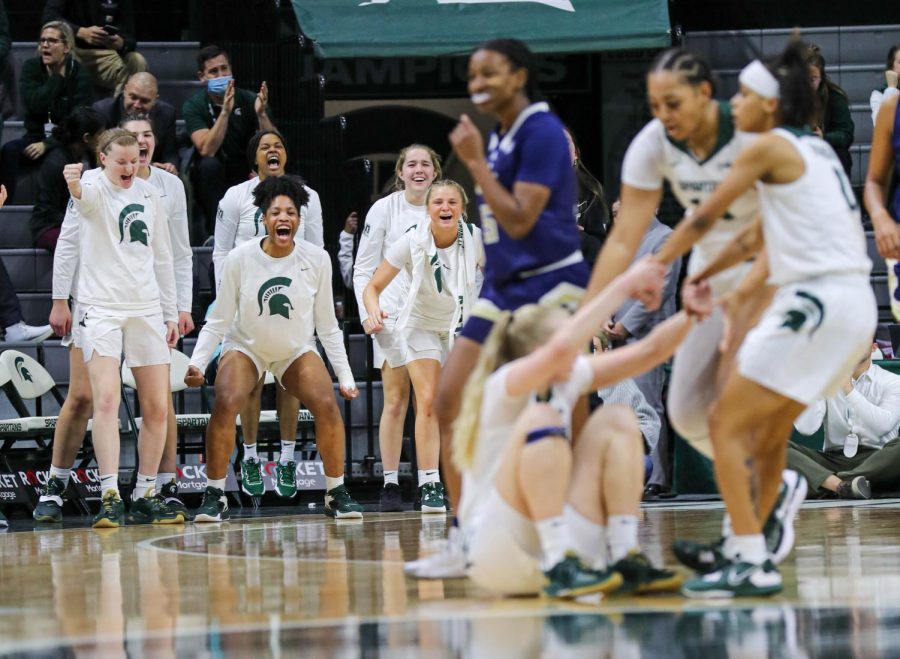The Michigan State bench celebrates after Matilda Ekh takes a charge during Michigan States loss to Georgia Tech on December 1, 2022. Photo Credit: Sarah Smith/WDBM