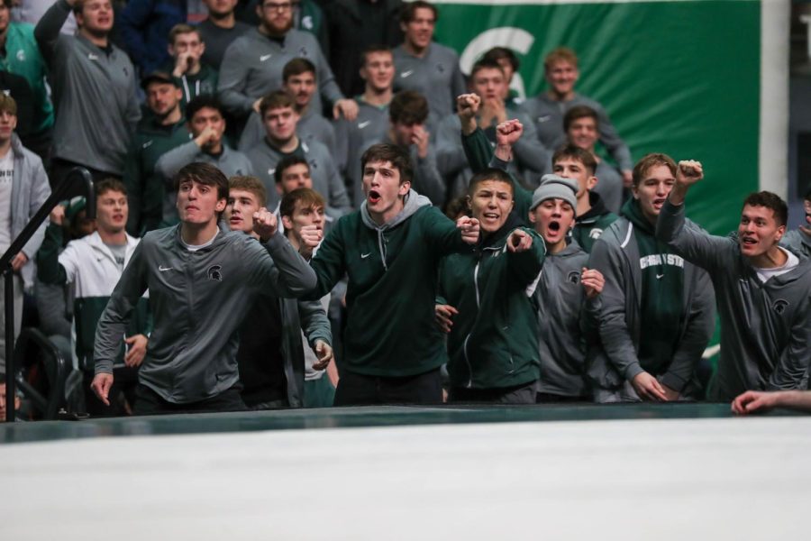 The Michigan State Wrestling team cheers on their teammates during Michigan States loss to Michigan on January 13, 2023. Photo Credit: Sarah Smith/WDBM