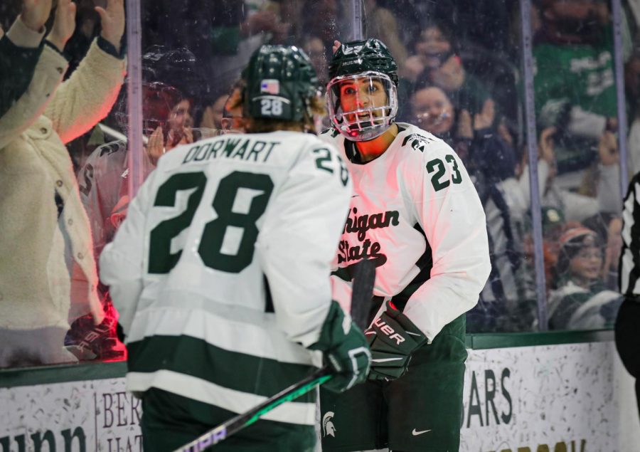 Jagger Joshua and Karsen Dorwart celebrate after Joshuas first goal during Michigan States tie with No. 5 Penn State on January 14, 2023. Photo Credit: Sarah Smith/WDBM