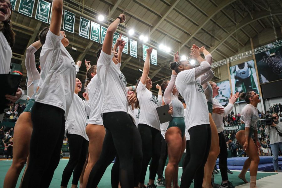 The+Michigan+State+Gymnastics+team+celebrates+after+their+197.200-196.975+victory+over+No.+3+Michigan+on+January+22%2C+2023.+Photo+Credit%3A+Sarah+Smith%2FWDBM