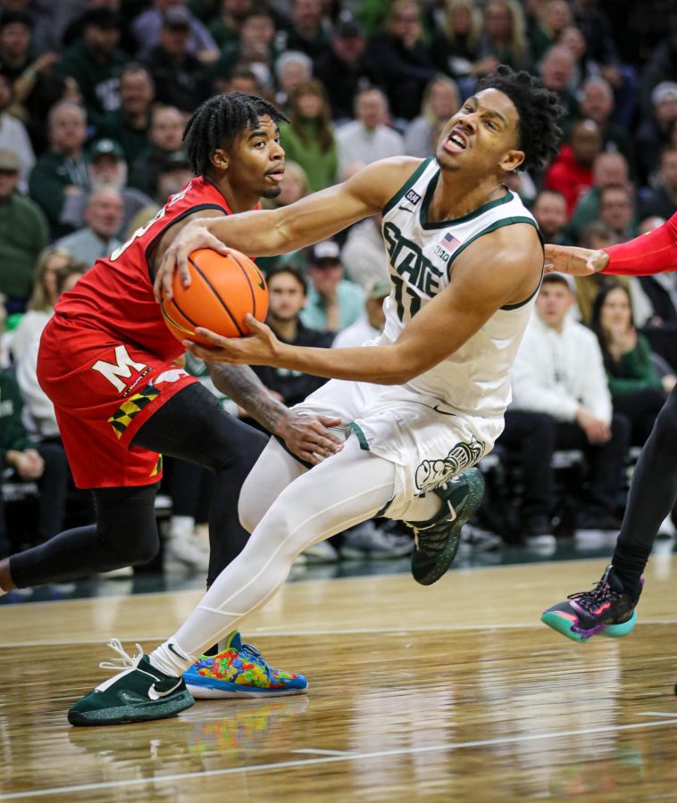 AJ Hoggard dribbles to the basket through traffic during Michigan States 63-58 victory over Maryland on February 7, 2023. Photo Credit: Sarah Smith/WDBM