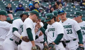 The Michigan State Spartans huddle before a game during the 2022 MSU baseball season. Photo Credit: Sarah Smith/WDBM