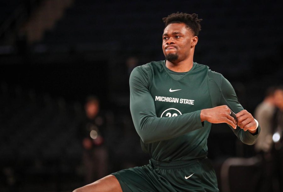 Mady Sissoko stretches before Michigan States practice on March 22, 2023 ahead of the Spartans Sweet Sixteen matchup against Kansas State. Photo Credit: Sarah Smith/WDBM
