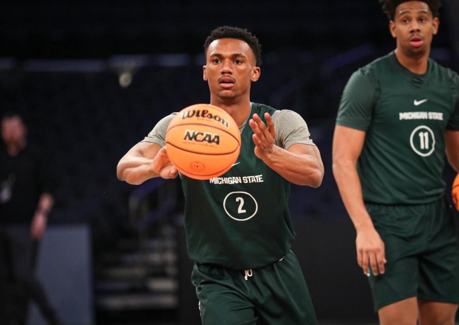 Tyson Walker passes the ball during Michigan States practice on March 22, 2023 ahead of the Spartans Sweet Sixteen matchup against Kansas State. Photo Credit: Sarah Smith/WDBM