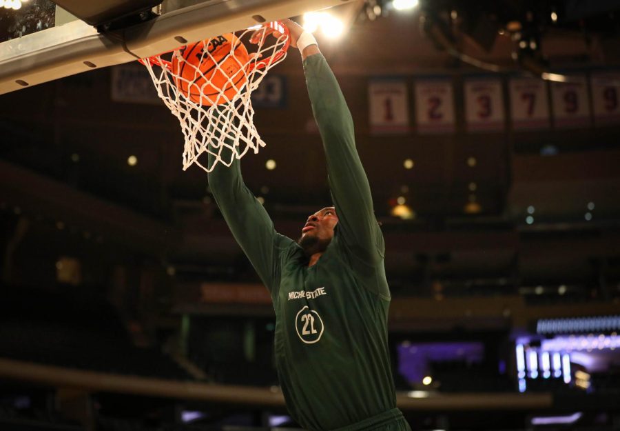 Mady Sissoko dunks the ball during Michigan States practice on March 22, 2023 ahead of the Spartans Sweet Sixteen matchup against Kansas State. Photo Credit: Sarah Smith/WDBM